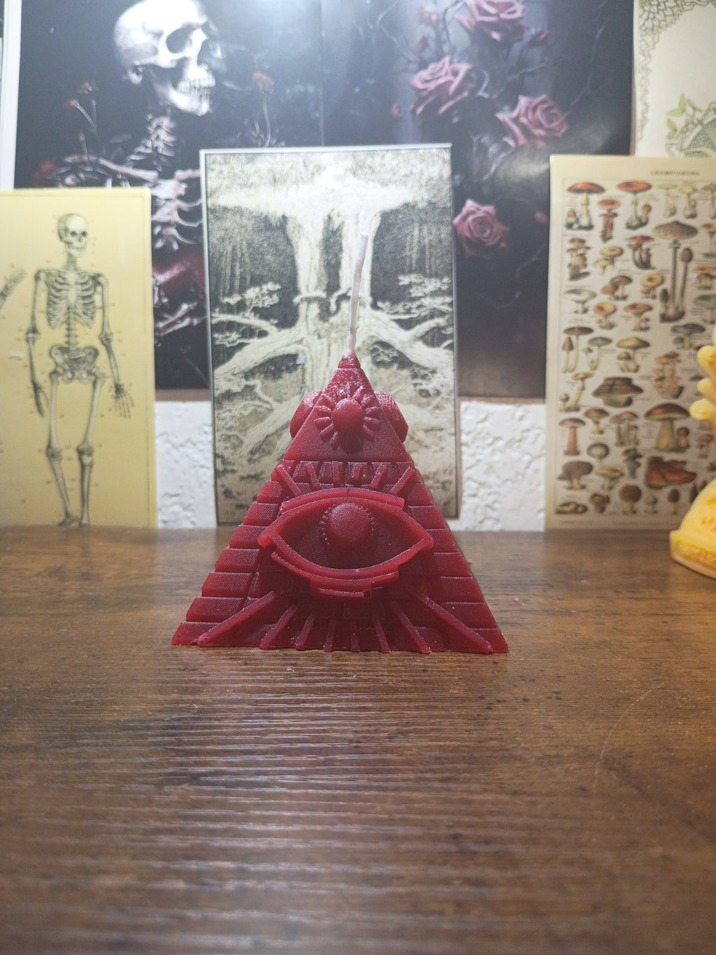 pyramid with eye candle